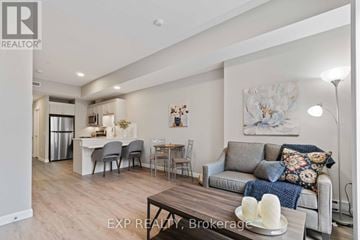 For rent in Perth - A living room with a grey couch and a wooden coffee table.