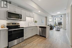 For rent in Perth - A modern kitchen with stainless steel appliances and white cabinets.