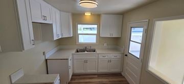Torrance apartment for rent - A kitchen with white cabinets and a window above the sink.