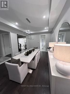Aurora (Aurora Highlands) house for rent - A modern dining room with a long table and chairs.