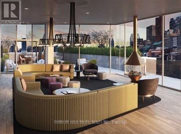 Toronto (Church-Yonge Corridor) condo for rent - A modern living room with a curved sofa and a coffee table.