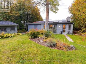 Collingwood house for rent - A house with a grey roof and a small garden in front.