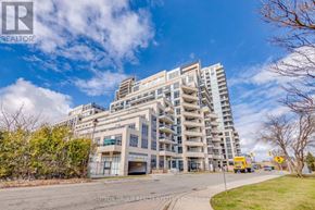 Richmond Hill (Langstaff) condo for rent - A large apartment building with a brokerage sign in front.