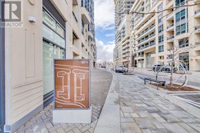 Richmond Hill (Langstaff) condo for rent - A sign with the letter "H" on it is placed on a sidewalk.