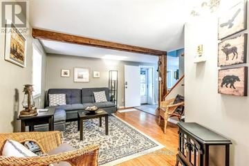 Waterloo house for rent - A living room with a grey couch and a rug.