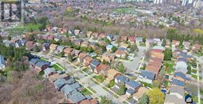 Toronto (Westminster-Branson) house for rent - A bird's eye view of a residential area with houses and trees.