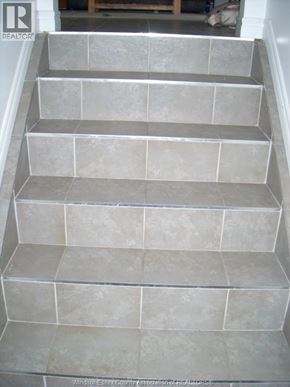 Windsor duplex for rent - A set of stairs with grey tiles.
