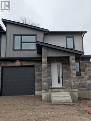 Woodstock (Woodstock - North) house for rent - A modern kitchen with white cabinets and a central island.