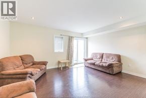 Windsor house for rent - A living room with a couch, chair, and table.