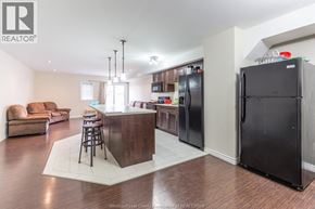Windsor house for rent - A kitchen with a bar and a refrigerator.