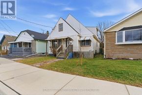 St. Catharines (Western Hill) duplex for rent - A house with a white exterior is for sale.