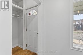 St. Catharines (Western Hill) duplex for rent - A white door with a window above it.