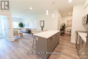Ottawa condo for rent - A well-lit kitchen with a dining table and chairs.