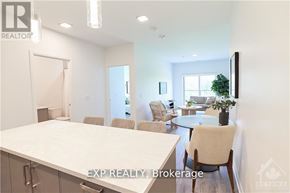 Ottawa condo for rent - A realtor's office with a desk and chairs.