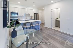 Ottawa condo for rent - A modern kitchen with a glass table and chairs.