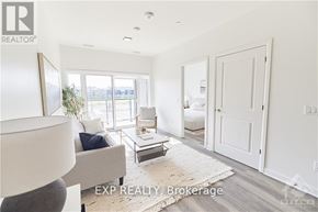 Ottawa condo for rent - A realtor's office with a large window and a couch.