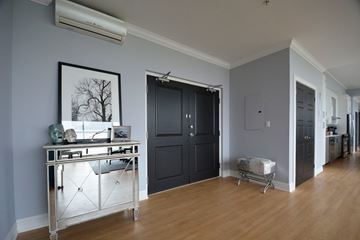 Halifax apartment for rent - A kitchen area with a sink and a fridge.