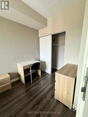 Waterloo condo for rent - A room with a desk and chair in it.