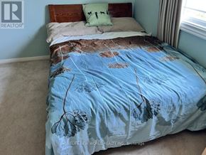 Toronto (Bayview Village) house for rent - A dining room with a table, chairs, and a painting on the wall.