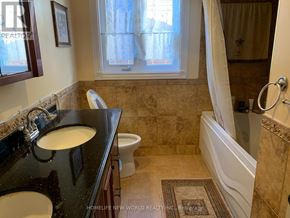 Toronto (Bayview Village) house for rent - A bathroom with a black countertop and a white sink.