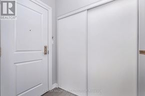 Ottawa condo for rent - A white door with a handle and a white wall.