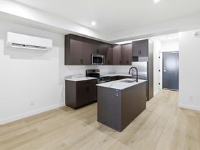 Swan River apartment for rent - A white shower stall with a glass door is in a bathroom with a white toilet and sink.