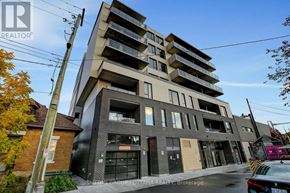 Ottawa condo for rent - A modern apartment building with a glass facade and a brick chimney.