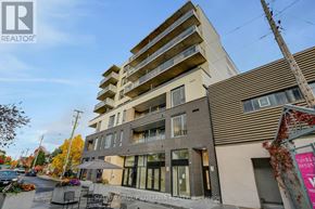 Ottawa condo for rent - A modern apartment building with a sign for Sutton Group Ottawa Realty Brokerage in front.