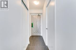 Burlington (Alton) condo for rent - A hallway with a door covered in plastic wrap.