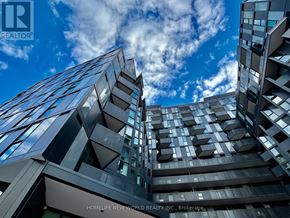 Toronto (Clanton Park) condo for rent - A modern building with glass windows and a sign that reads "HOMELIFE NEW WORLD REALTY INC., Brokerage.".