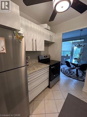 Hamilton apartment for rent - A modern kitchen with a stainless steel refrigerator and black countertops.