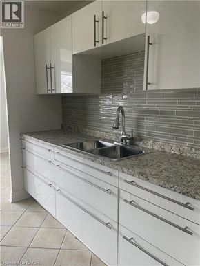 Hamilton apartment for rent - A modern kitchen with a sink and cabinets.