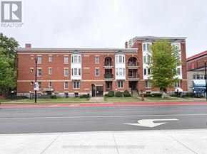 London East (East F) condo for rent - A red brick building with a white door and windows.