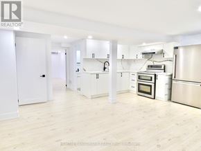 Whitby (Pringle Creek) house for rent - A kitchen with white cabinets and stainless steel appliances.