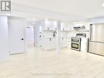 Whitby (Pringle Creek) house for rent - A kitchen with white cabinets and stainless steel appliances.