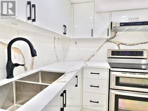 Whitby (Pringle Creek) house for rent - A kitchen with a sink and a counter.