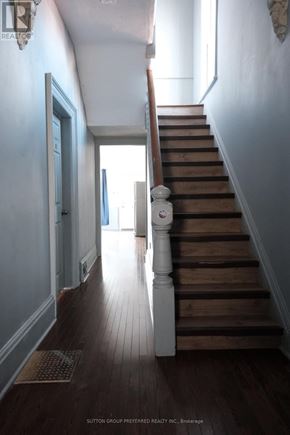 London East (East B) house for rent - A staircase with a light on the side.