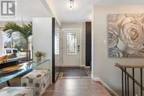 Richmond Hill (South Richvale) house for rent - A hallway with a glass table and a painting on the wall.