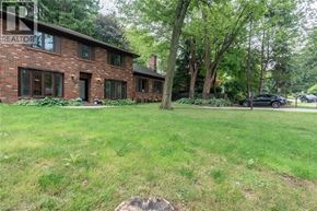 Ancaster house for rent - A house with a lawn in front of it.
