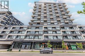 Oakville (Ro River Oaks) condo for rent - A modern multi-story building with a glass facade and a car parked in front.