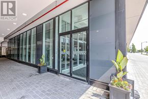 Oakville (Ro River Oaks) condo for rent - A building with glass doors and windows with the logo INTERNATIONAL REALTOR on the ground.