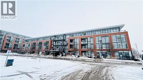 Kitchener condo for rent - A large building with a lot of windows and a sign that says REALTOR.