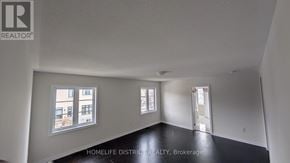 Clarington (Newcastle) duplex for rent - A room with a window overlooking a building.