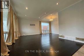 Toronto (Wexford-Maryvale) house for rent - A spacious room with a black floor and beige curtains.