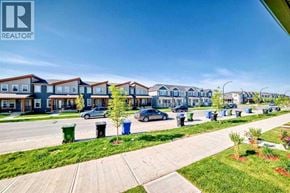 For rent in Calgary - A row of houses with a REALTOR® logo in the corner.