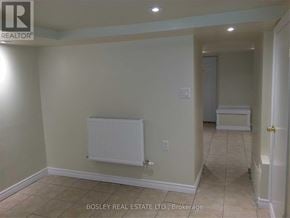 Toronto (Weston) triplex for rent - A room with a white radiator on the wall.