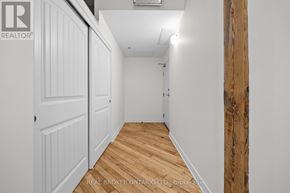Carleton Place multi-family for rent - A hallway with wood flooring and white walls.