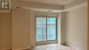 Toronto (Waterfront Communities) condo for rent - A room with a window and a sign that says REALTOR.
