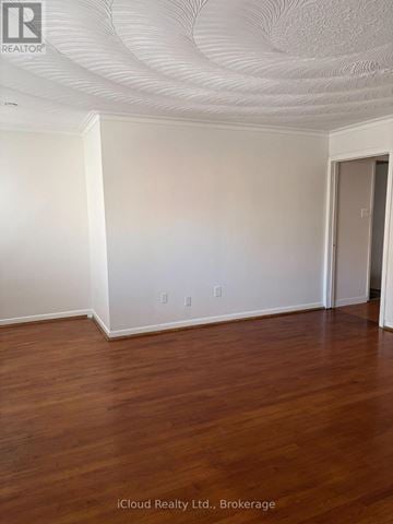 Toronto (Islington-City Centre West) other for rent - A kitchen with white cabinets and black countertops.