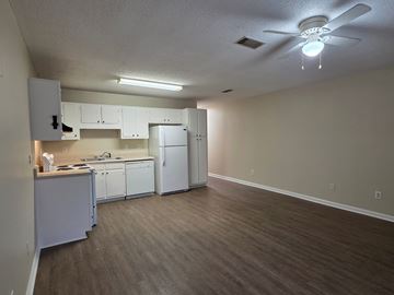 Albany apartment for rent - A kitchen with white cabinets and a white refrigerator.